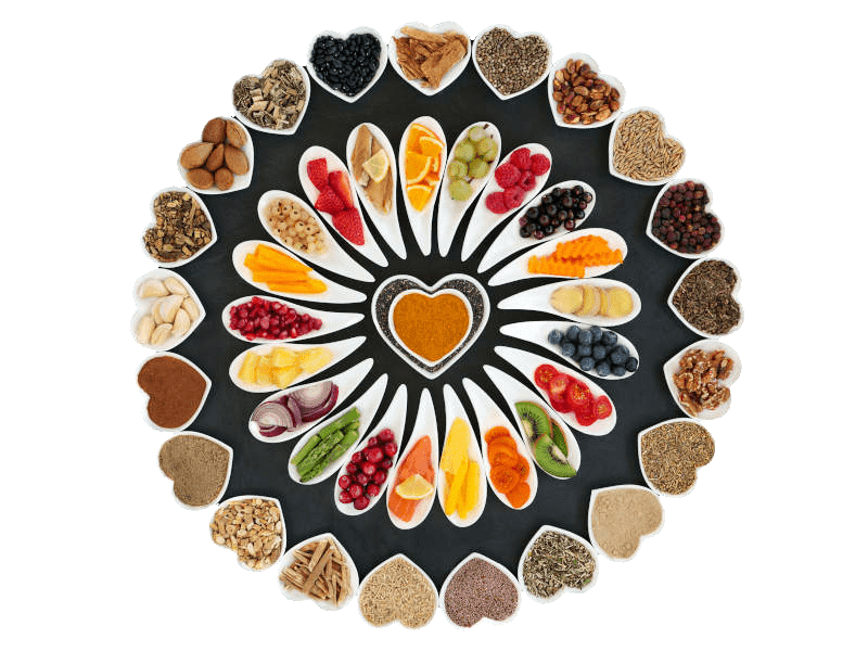 A array of healthy foods organised in a circular fashion using mini dishes.