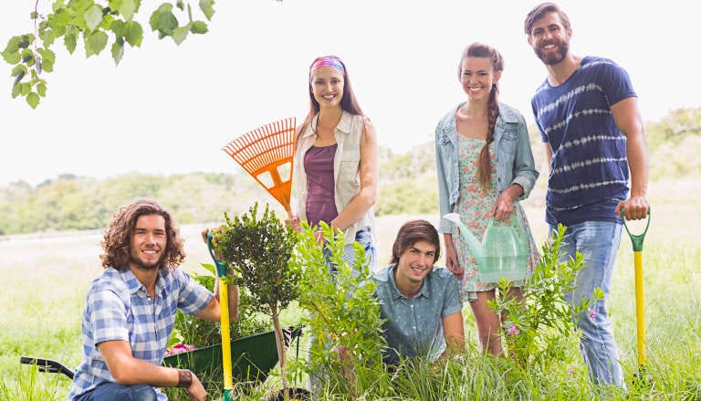 Happy community group gardening.